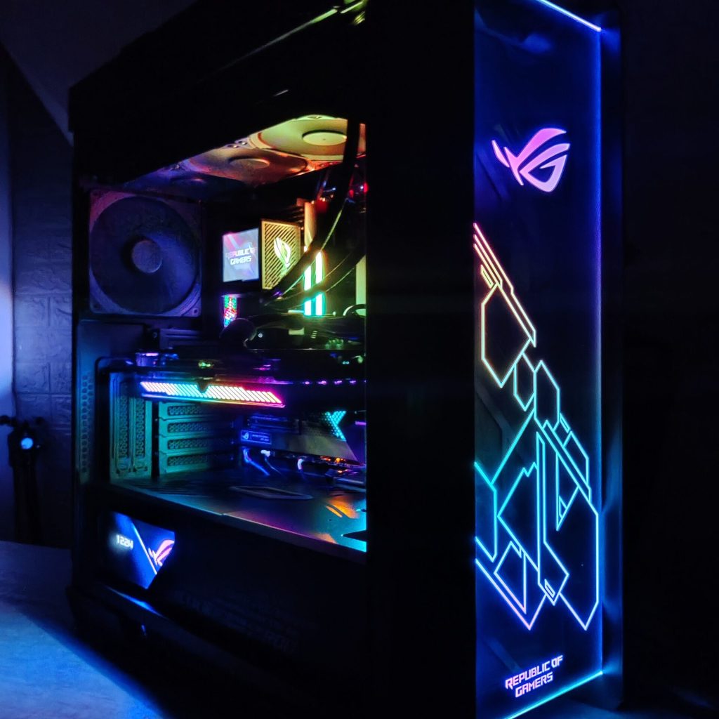 High-performance ASUS ROG custom gaming PC with vibrant RGB lighting and clear side panel, built and optimized by PCExperts101 in Singapore.